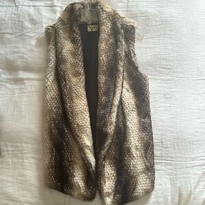 Pristine condition, faux fur vest.